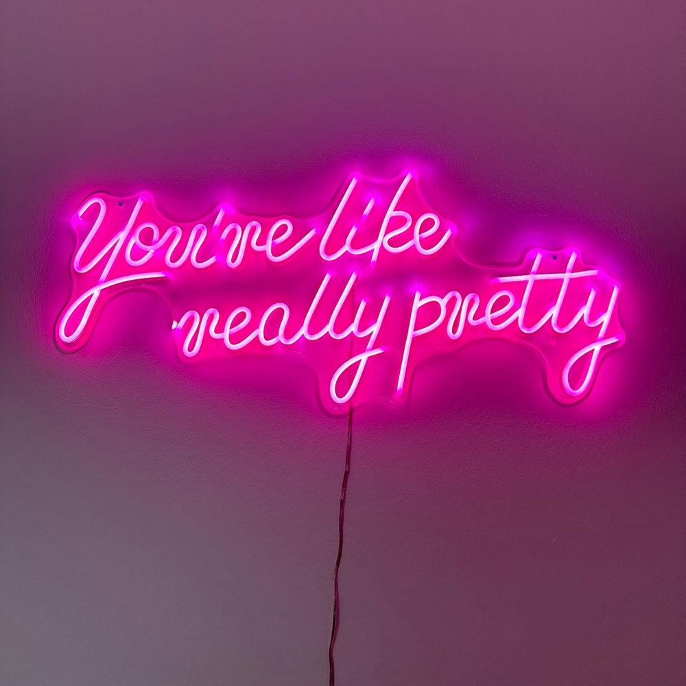 “You’re like really pretty” neon sign